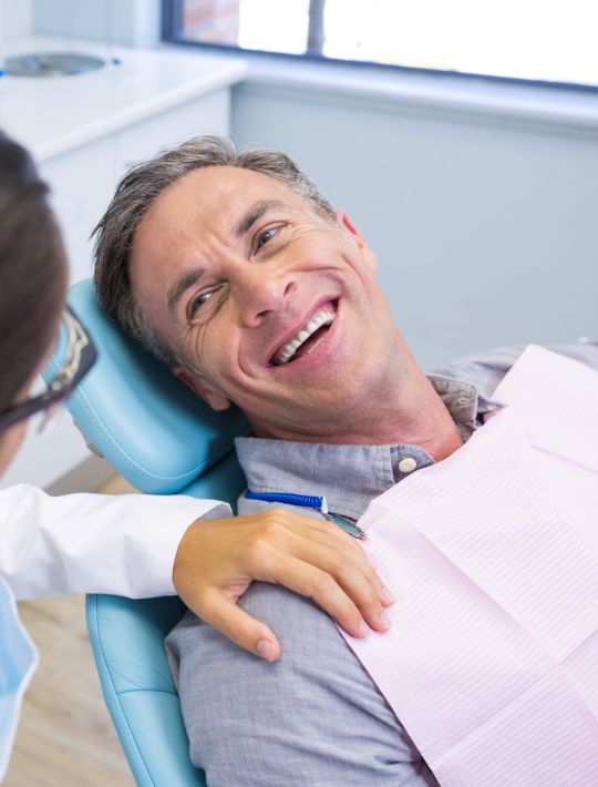 Happy Patient on the dentist chair